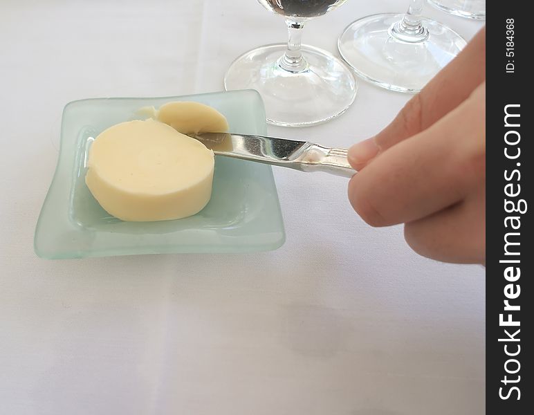 Diner Serves from Pat of Butter at Restaurant