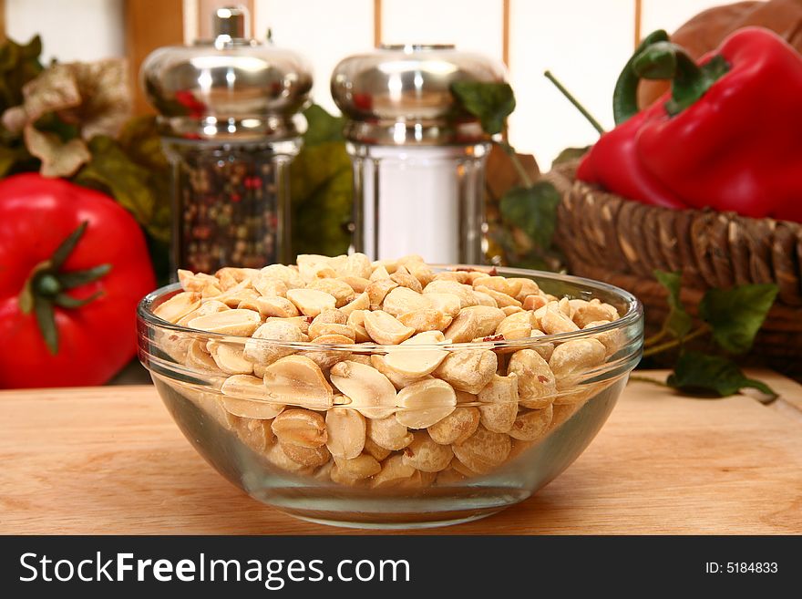 Unsalted dry roasted peanuts in a bowl in kitchen or restaurant. Unsalted dry roasted peanuts in a bowl in kitchen or restaurant.