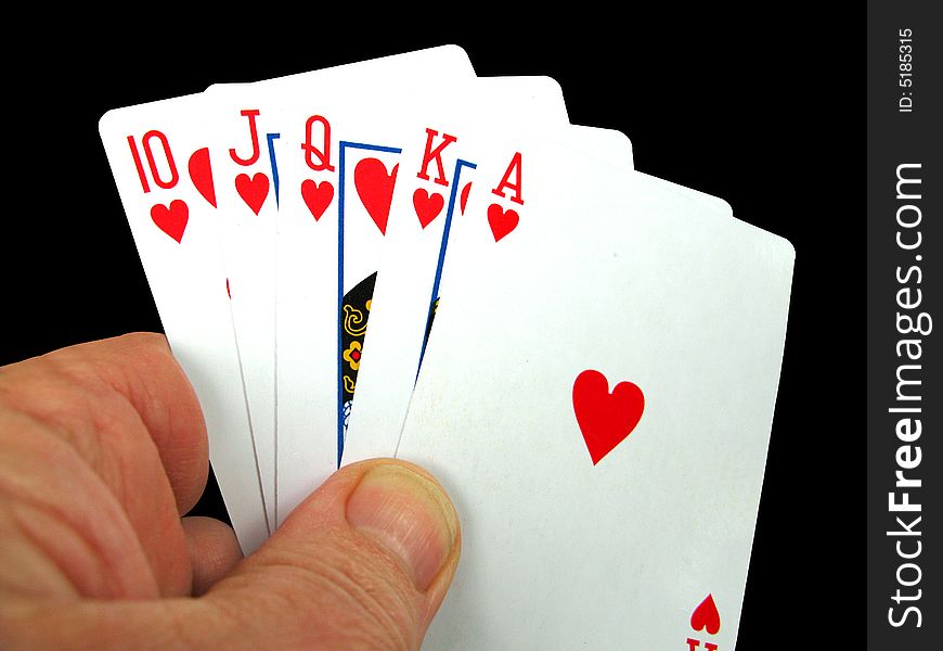 Person holding the royal flush in hearts