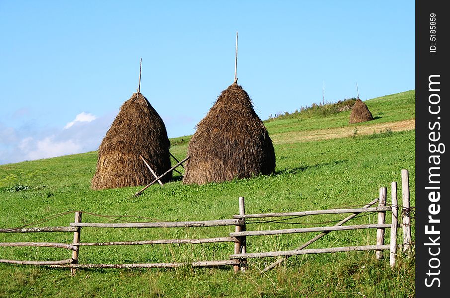 Stacks of hay in mountain village. Carpathians, Ukraine