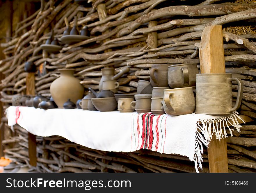 Brown clay pots on a woody background