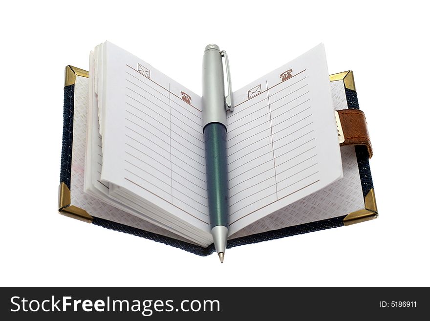 The opened notebook and ball pen on a white background