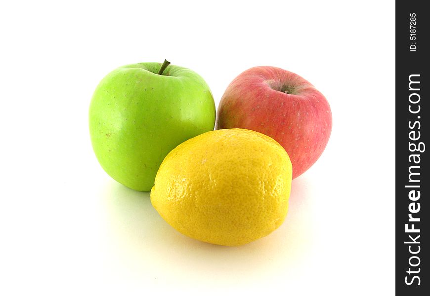 Green, red apple and yellow lemon on white background. Green, red apple and yellow lemon on white background.