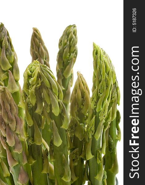 A bunch of fresh asparagus tips in closeup