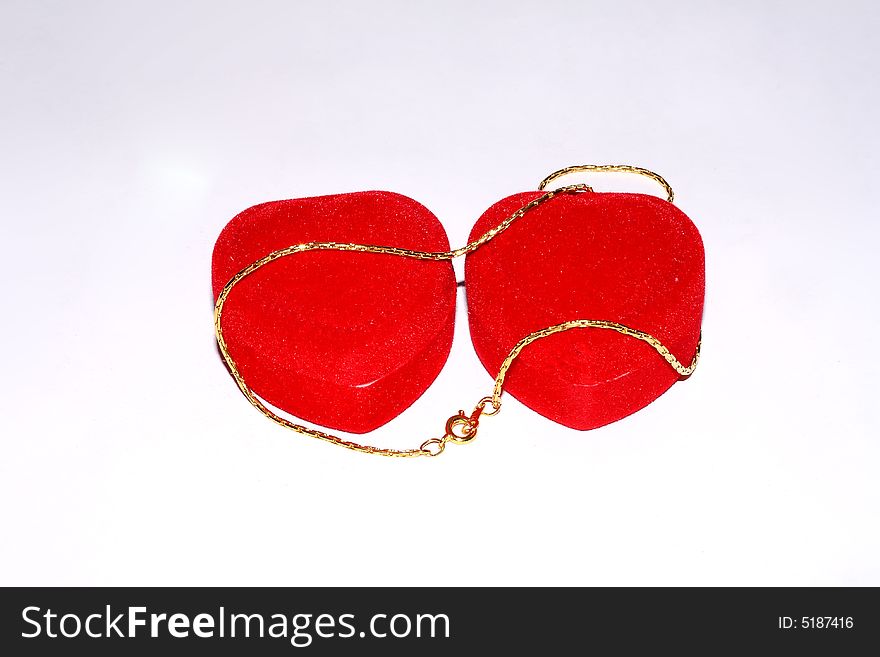 Jewelry chain in red case on white background