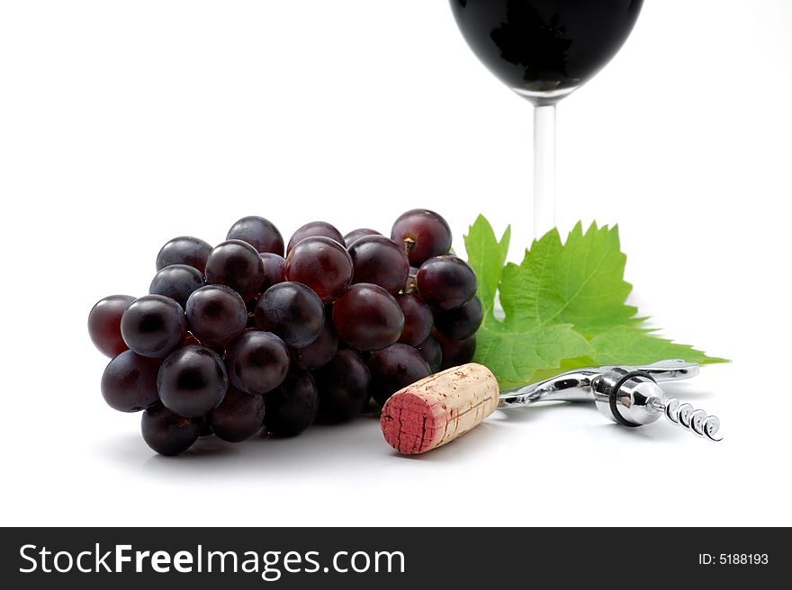 Corkscrew, cork and grapes isolated over white. Corkscrew, cork and grapes isolated over white