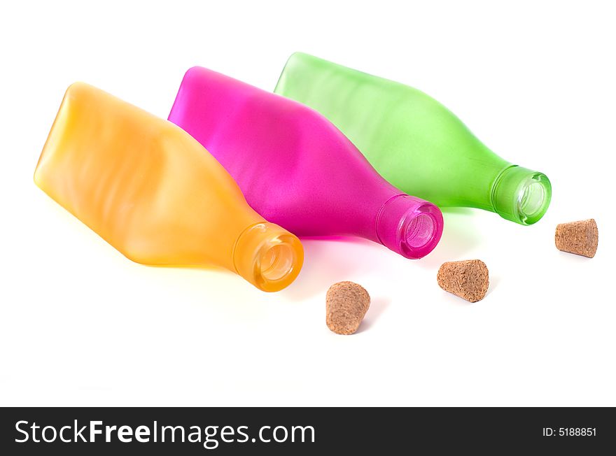 Colorful bottles on a white background with copy space. Colorful bottles on a white background with copy space