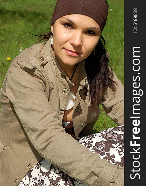 Attractive woman relaxing on green grass. Attractive woman relaxing on green grass