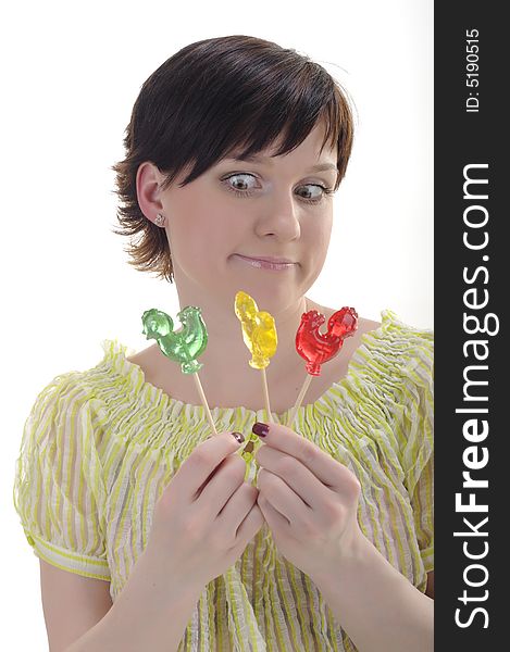 Surprised woman with red, green and yellow candies. Surprised woman with red, green and yellow candies