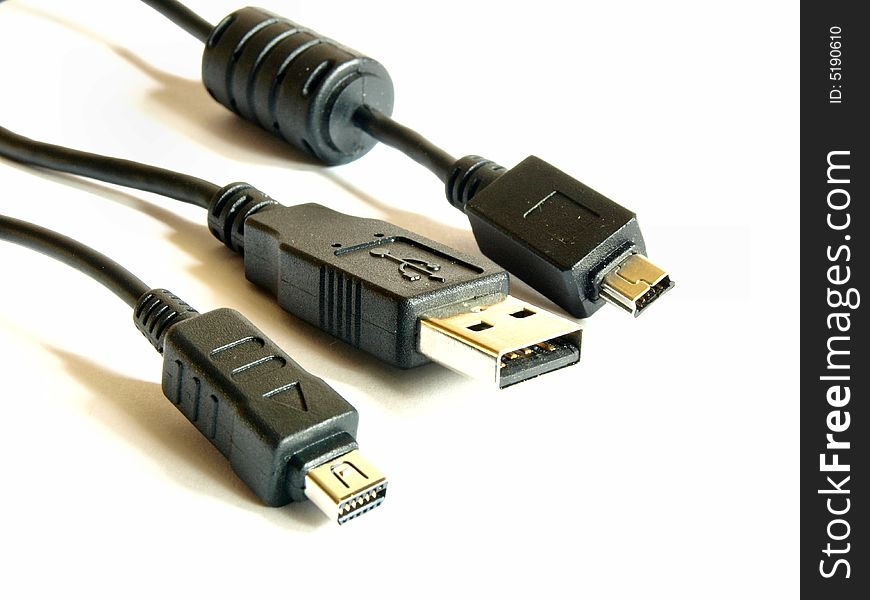 Three USB plugs on white background