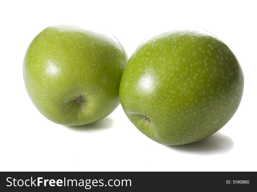 Two green apple on the white background with shadow.