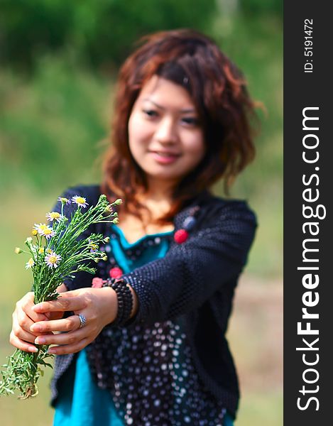 Young girl hold the flowers. Young girl hold the flowers