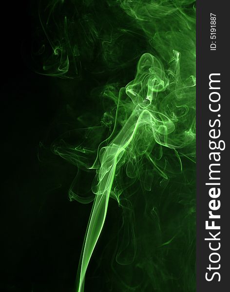 Green smoke texture at black background. Green smoke texture at black background