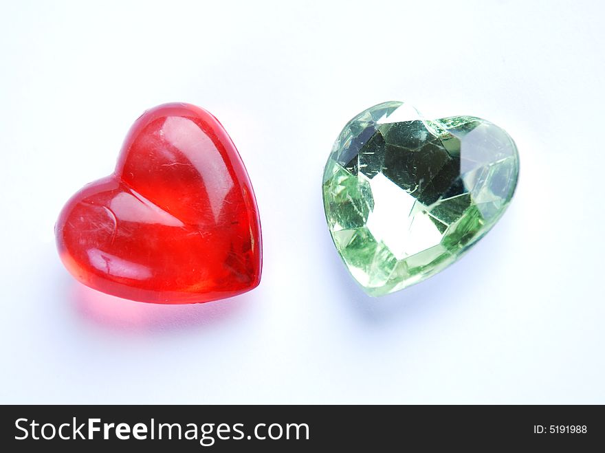 Red and green heart at white background