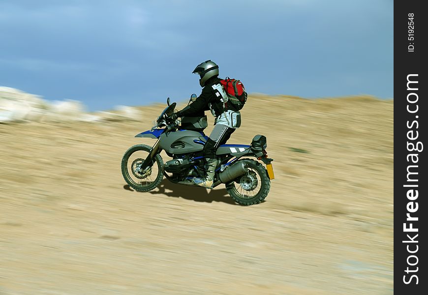 Man riding on motorcycle on blurred background. Man riding on motorcycle on blurred background.