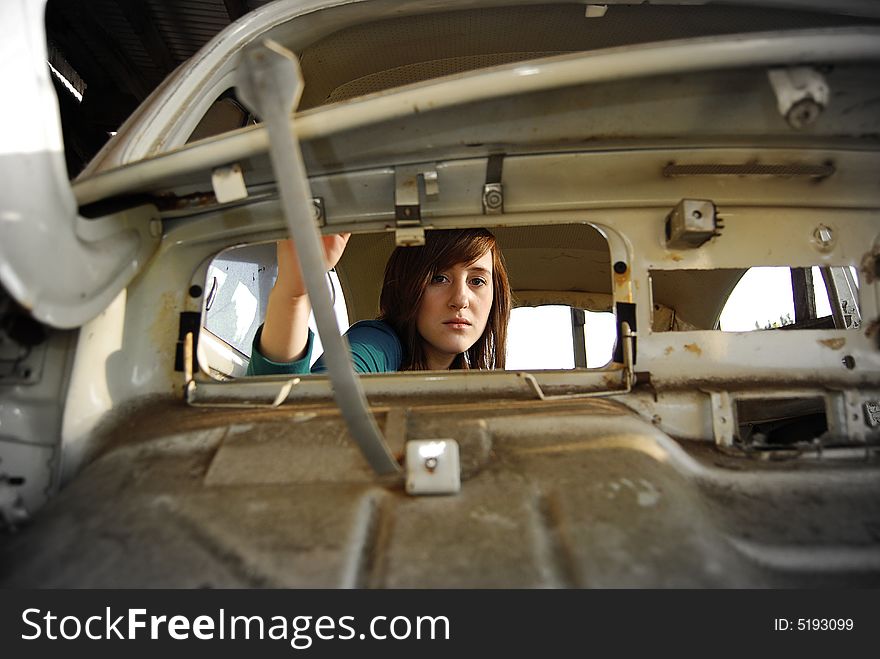 Girl looking trough the glove compartment space. Girl looking trough the glove compartment space