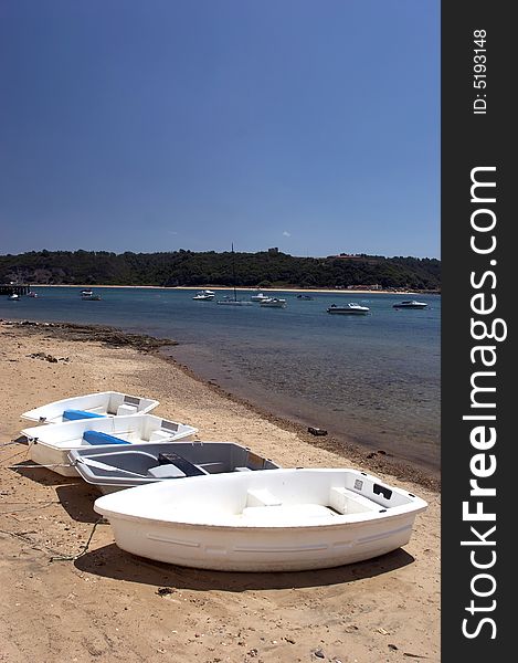 Boats isolated at the beach, in a beautiful sunny day