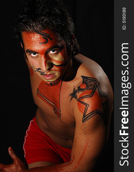 Portrait of young hispanic male model wearing artistic bodypaint drawing. Portrait of young hispanic male model wearing artistic bodypaint drawing