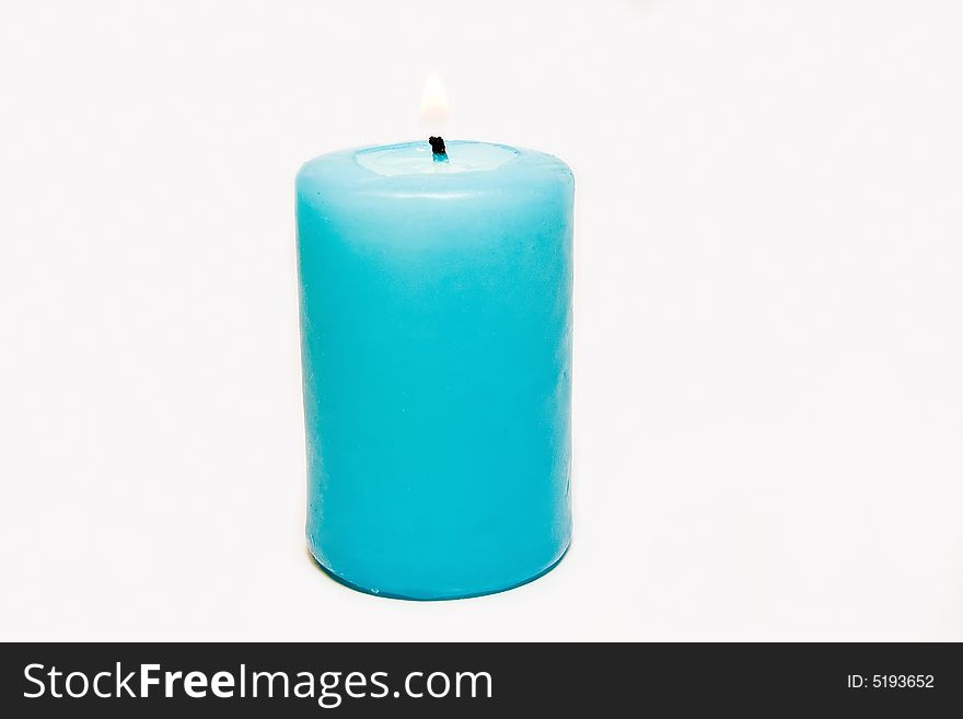 Isolated blue candle over white background