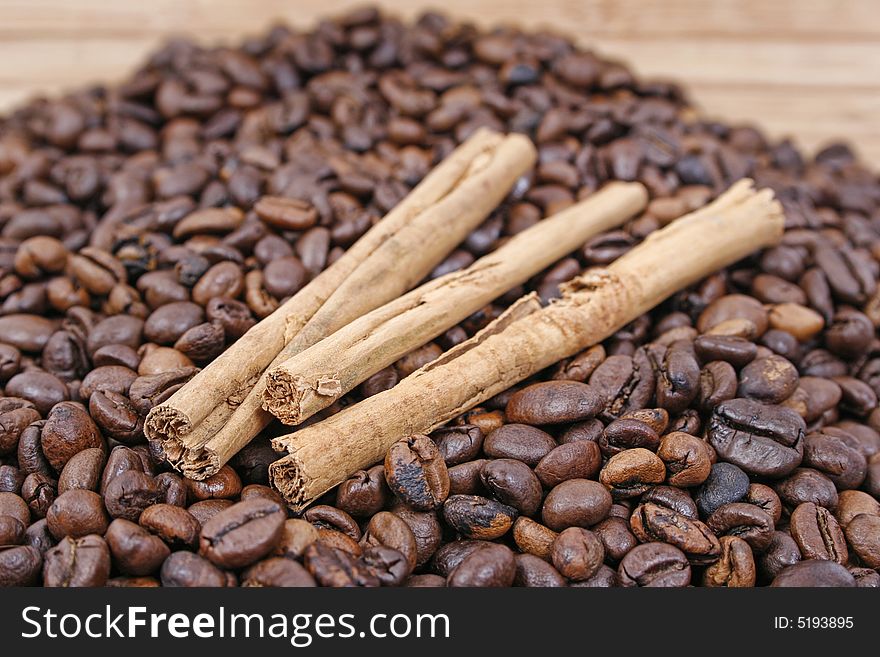 Cinnamon sticks and coffee beans. Cinnamon sticks and coffee beans