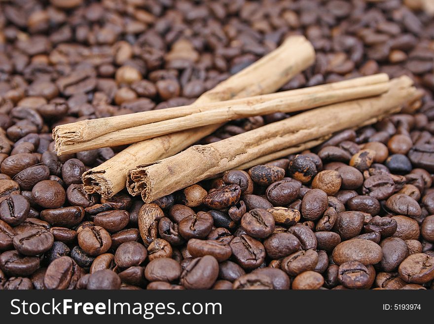 Cinnamon sticks and coffee beans. Cinnamon sticks and coffee beans