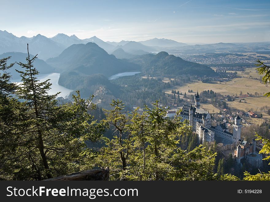 Famous castle Neuschwanstein. Bavaria, Germany. Birds-eye view from a mountain.