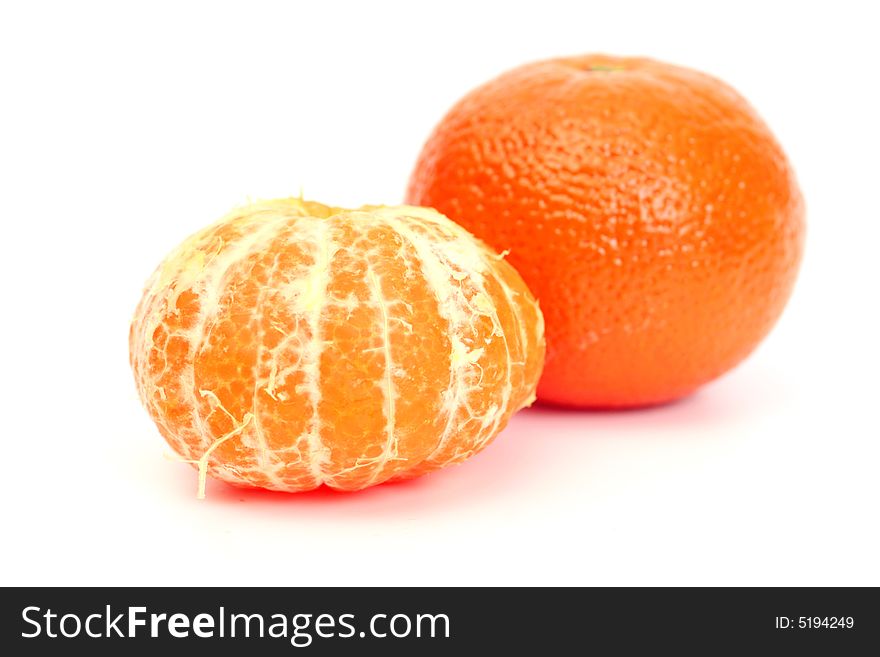 Two tangerines isolated over white background