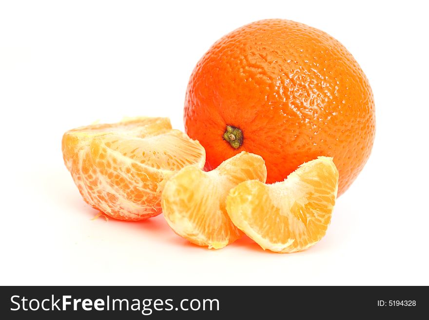 Whole tangerine and segments of a tangerine. Whole tangerine and segments of a tangerine