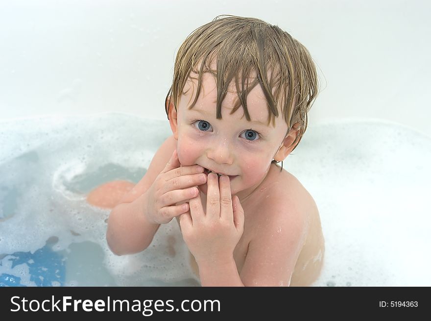 Cheerful Boy In Bath On White Background
