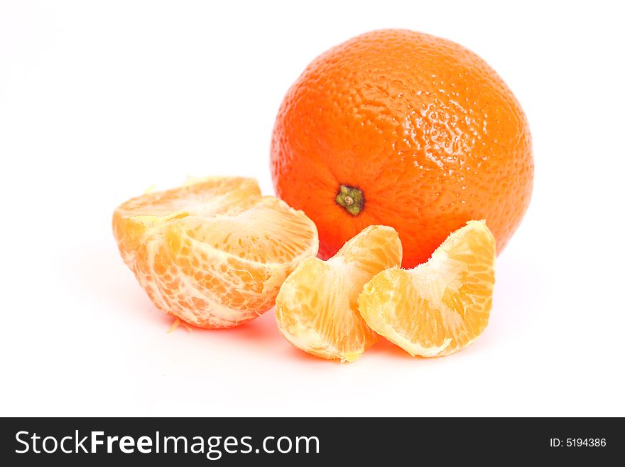 Whole tangerine and segments of a tangerine. Whole tangerine and segments of a tangerine