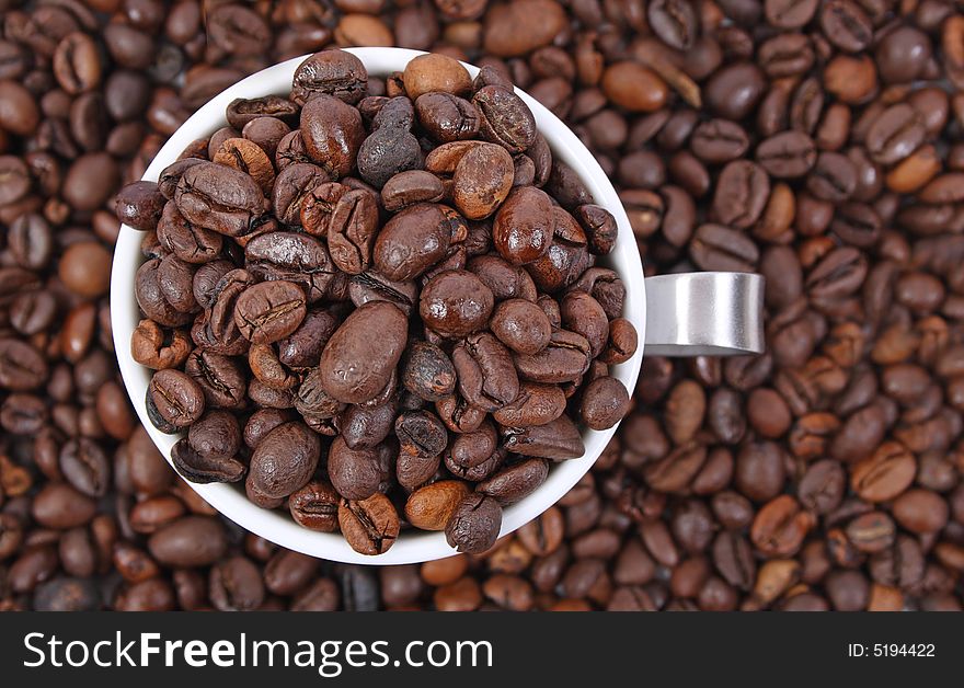 Cup of coffee beans closeup