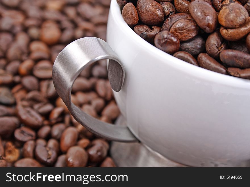 Cup of coffee beans closeup