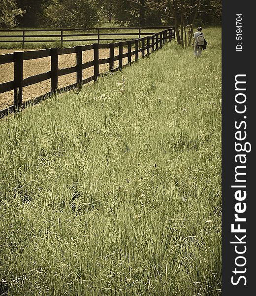 Man Walking Through A Field