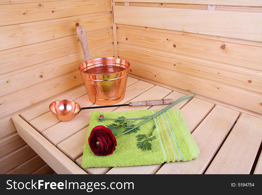 Interior of a Finnish sauna with flower and towel