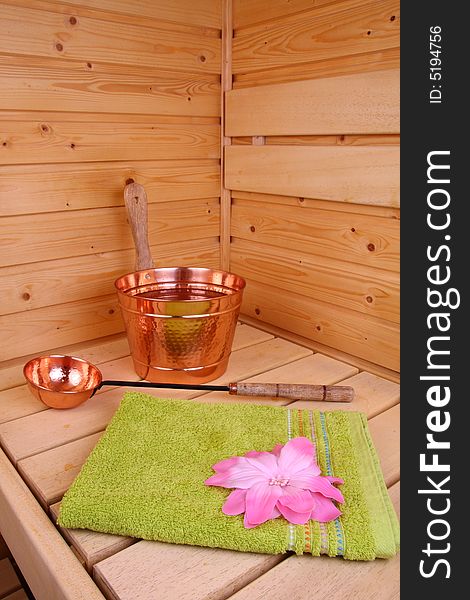 Interior of a Finnish sauna with flower and towel