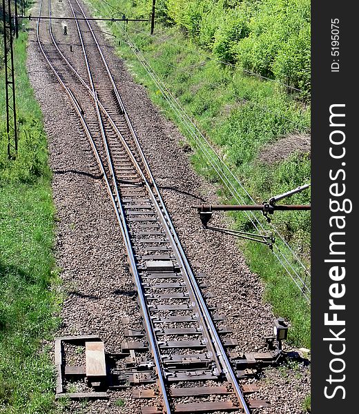 Single railway track splitting into two seen from above. Single railway track splitting into two seen from above.
