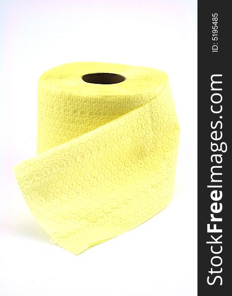 Isolated photo of roll of yellow toilet paper