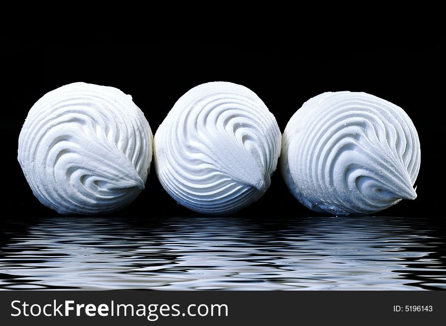 Three sweet zephyrs on a black background. Three sweet zephyrs on a black background