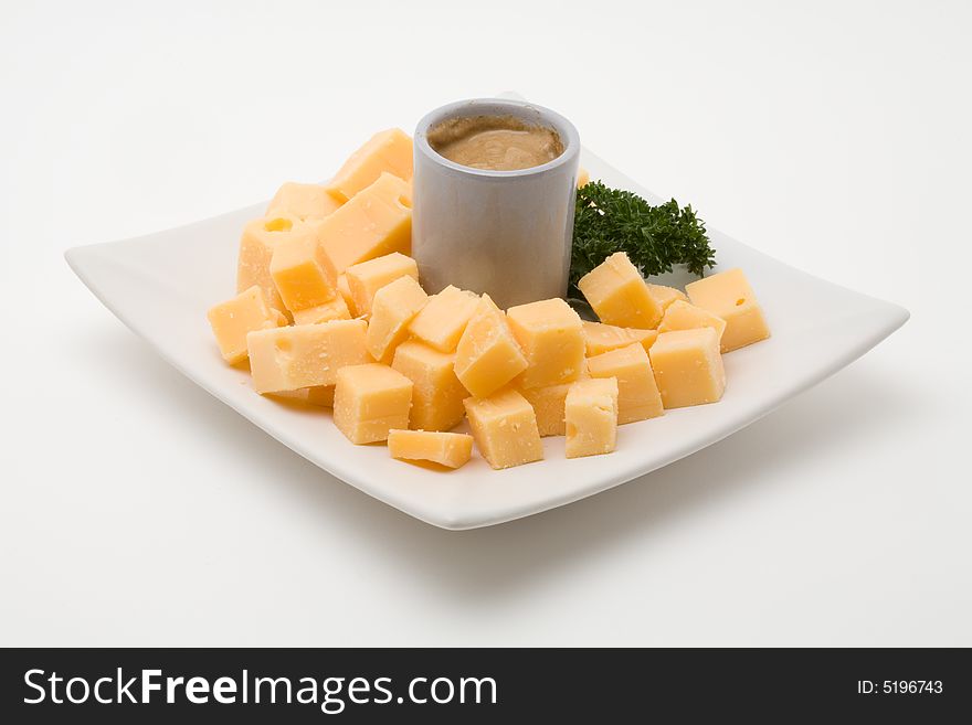 Cheese snack with mustard on a plate