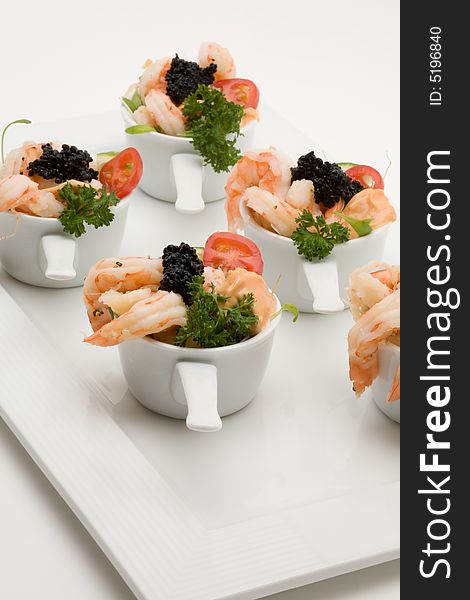 Prawn appetizer with caviar in little bowls