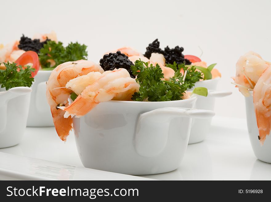 Prawn appetizer with caviar in little bowls