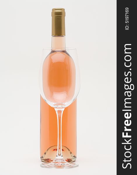 Rose Wine Bottle With Empty Glass