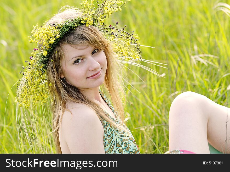Vivid picture of nice young lady relaxing at summer meadow. Vivid picture of nice young lady relaxing at summer meadow