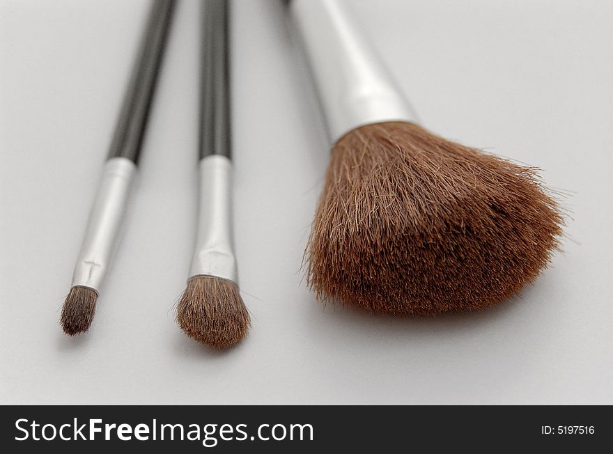 Make up brush on gray background