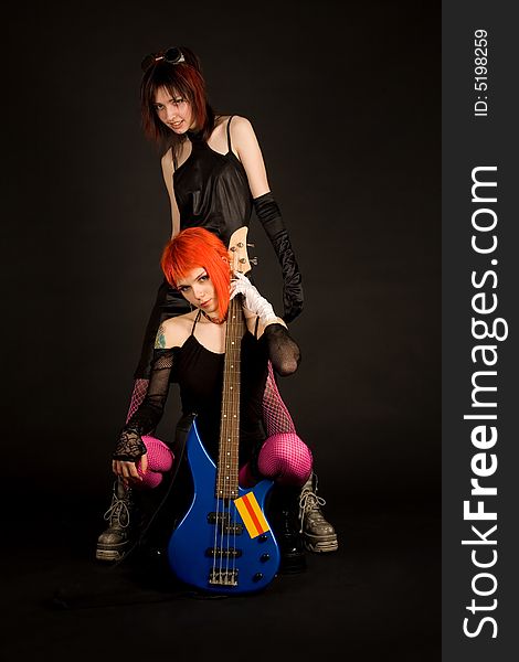 Two rock girls with guitar