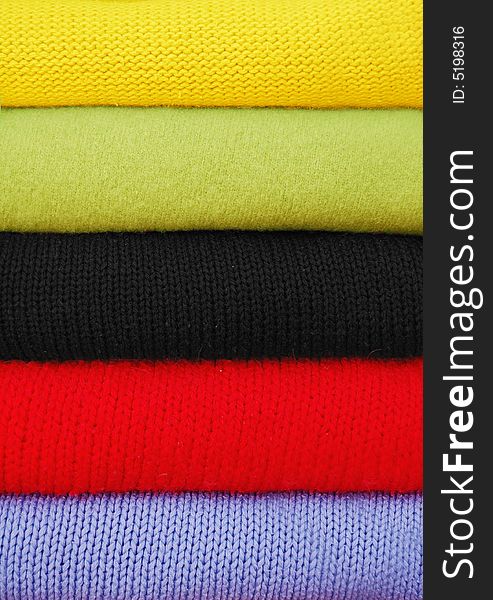 Colored textile clothes set in the vertical stack