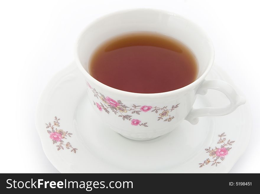 Tea in china cup with decorations. Tea in china cup with decorations