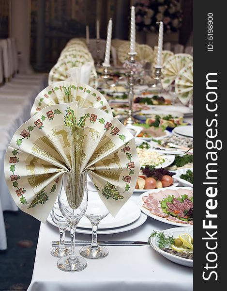 all ready for a banquet table covered, waiting for guests. all ready for a banquet table covered, waiting for guests