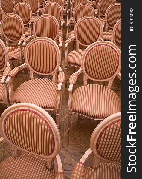 Old style chairs in an auditorium of a historic castle's music hall. Old style chairs in an auditorium of a historic castle's music hall...