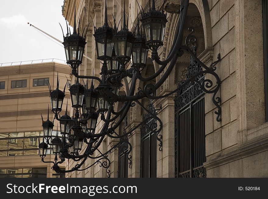 Decorative lamppost on a building in Boston, Mass